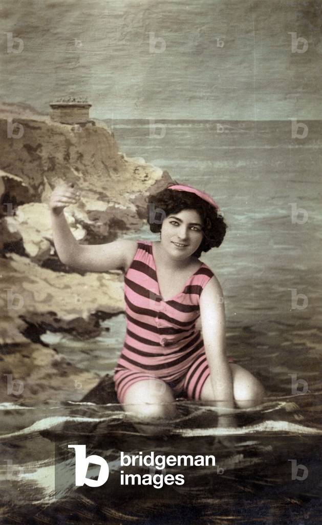 A bather with bathing suit, c. 1920, postcard