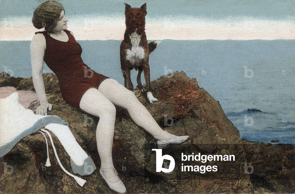 Bather on a rock with a dog, postcard, 1923