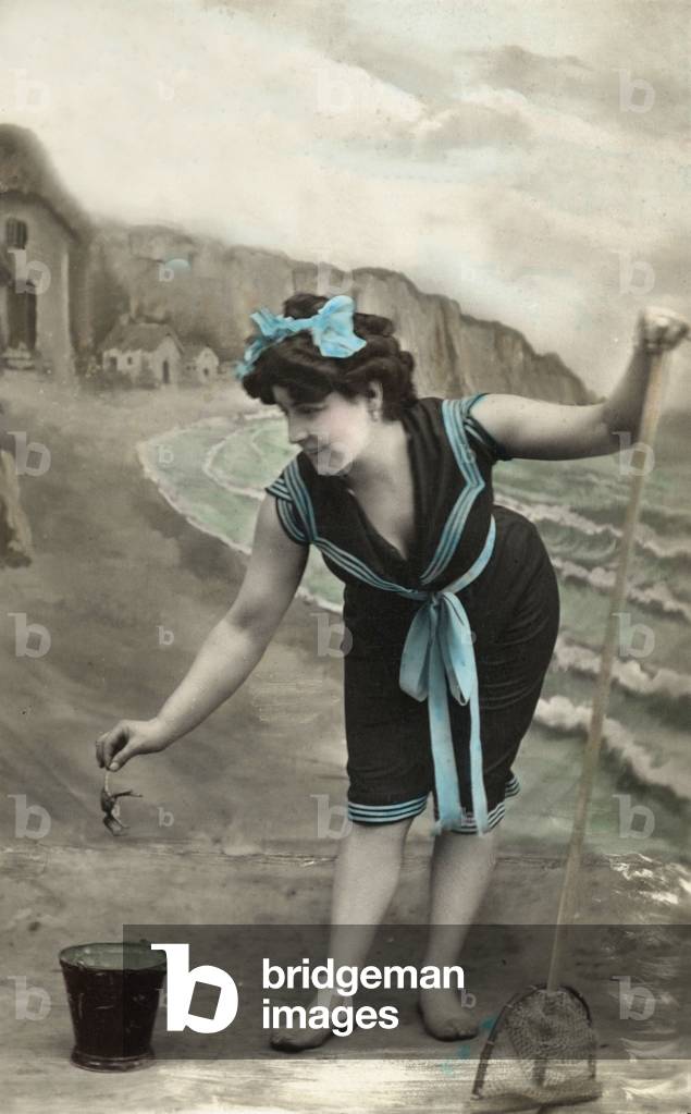 A bather with swimsuit fishing, c. 1906, postcard