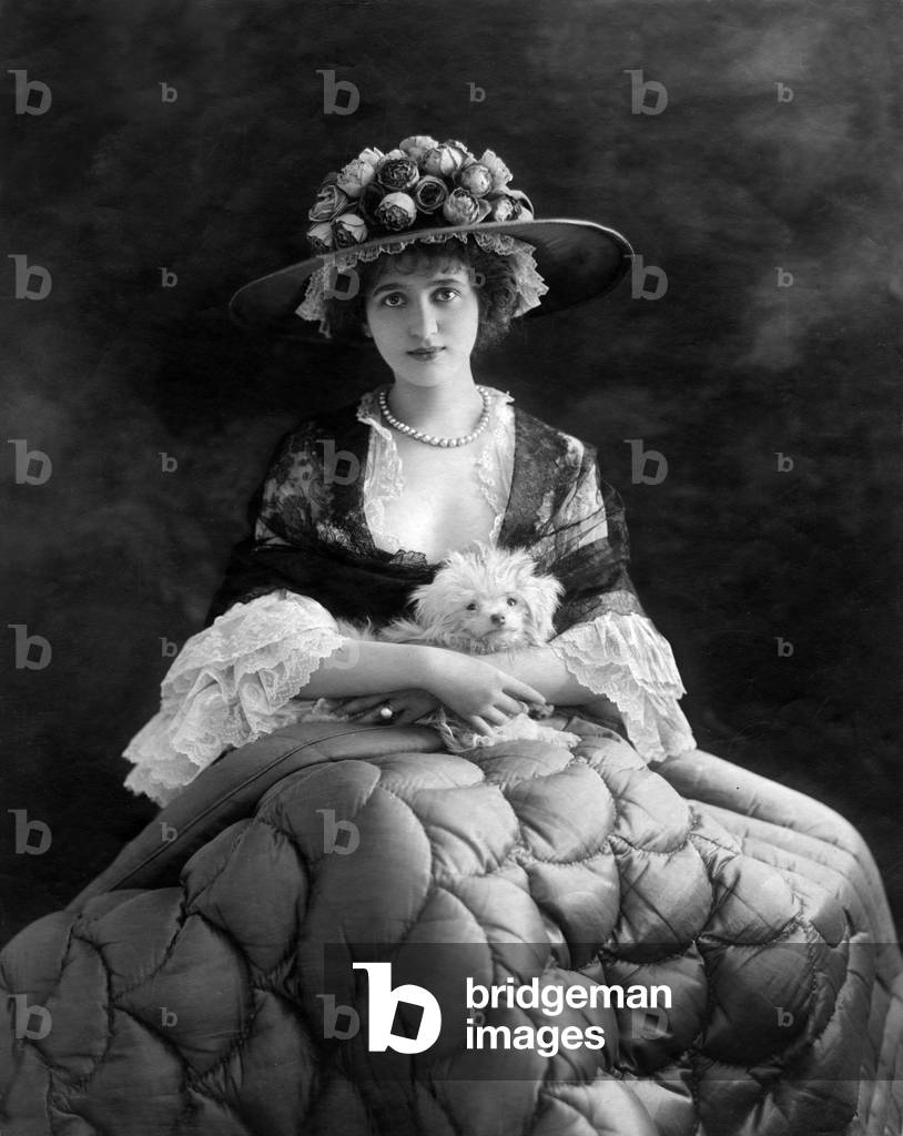 Marie Elise Gabrielle Caire (a.k.a Gaby Deslys, 1881-1920), French dancer and actress, here with a dog, c. 1899