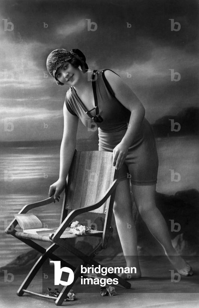 A bather wearing bathing suit, postcard, c; 1910