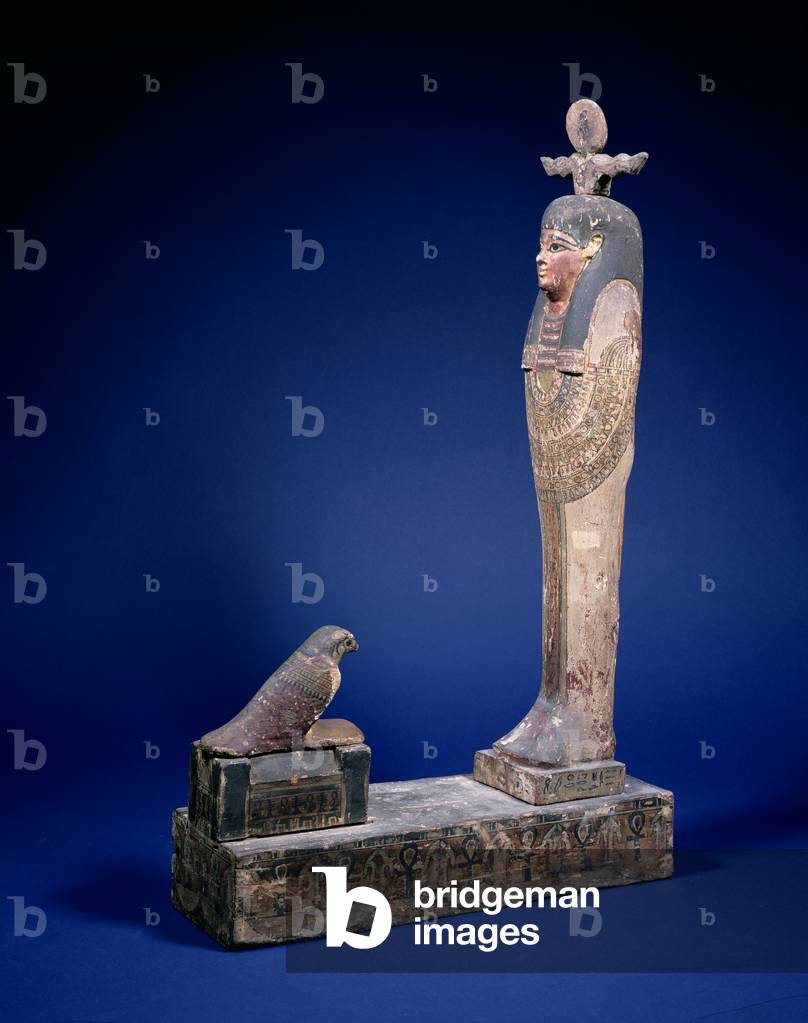 Ptah-Soker-Osiris figure standing on a box plinth facing a sarcophagus with a Horus falcon, funerary object, Egyptian, Ptolemaic Period, c. 200 BC (polychrome wood)