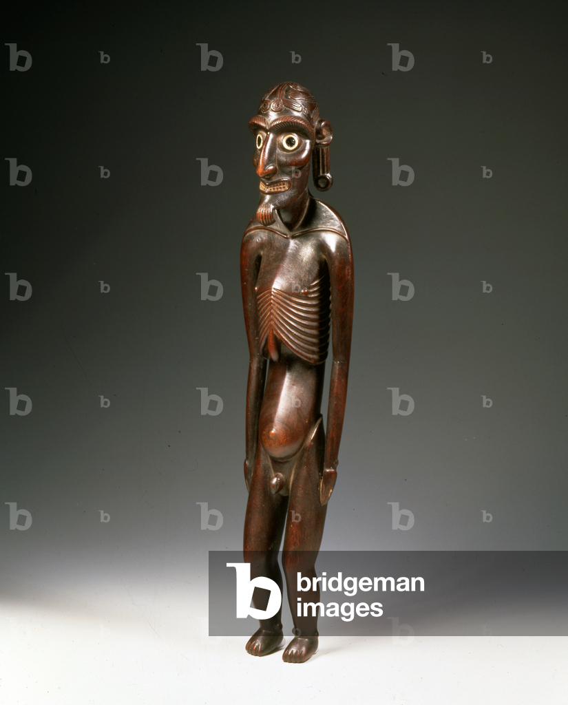 Figurine in the form of Moai Kavakava with obsidian-inset eyes from the Easter Islands (toromiro)