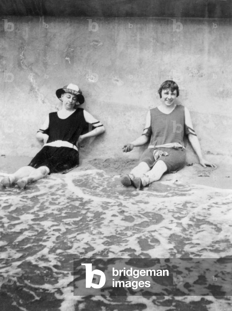 Ladies lounging at the beach, circa 1920s. Scanned vintage original photo