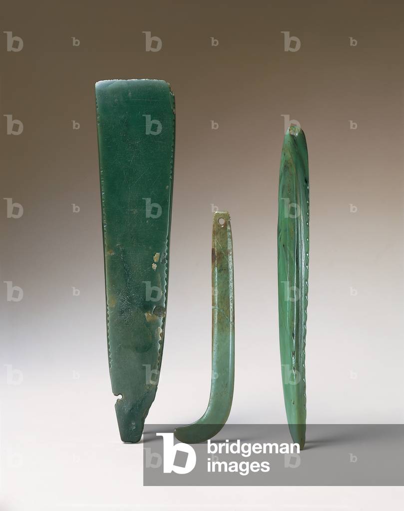 l-r: Toki pou tangata, adze blade, 18th century or earlier (greenstone); Kapeu, earring, 18th century or earlier (greenstone); Whao, chisel, 18th century or earlier (greenstone); 
