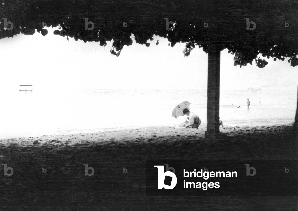 A Japanese geisha on Waikiki beach (b/w photo)