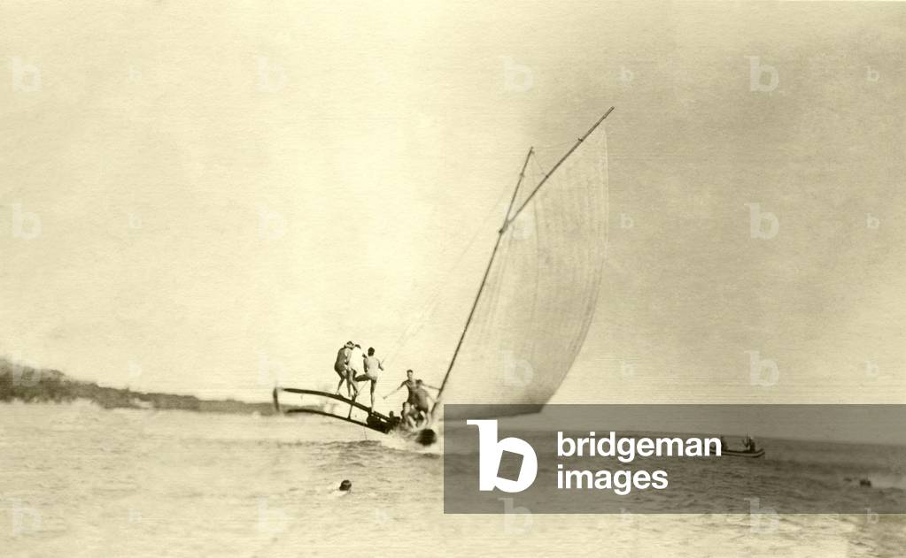 An outrigger canoe under sail, Waikiki, c.1920s (b/w photo)