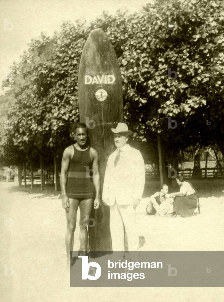David Kahanamoku and friend, on Waikiki Beach (b/w photo)