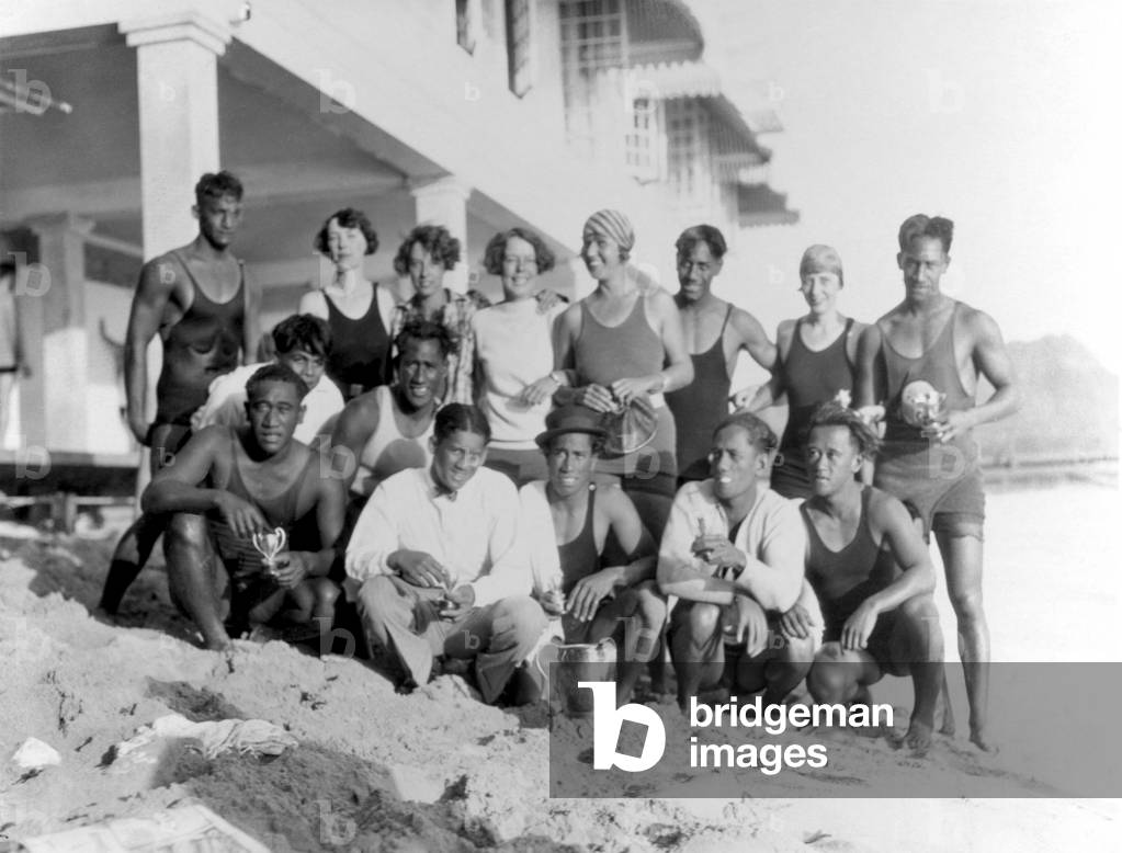 Beach boys and bathers in front of the Moana Hotel, Waikiki, c.1920s (b/w photo)