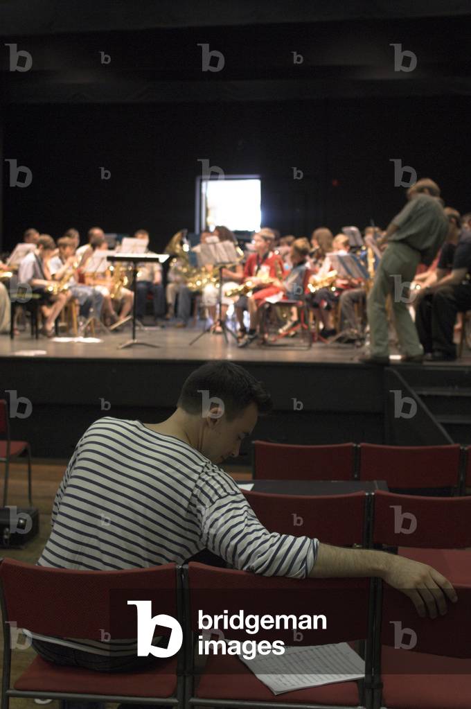 Joseph Phibbs - portrait of the English composer sitting in front of a youth orchestra in Jubilee Hall, Aldeburgh during the Aldeburgh Festival, June 2005