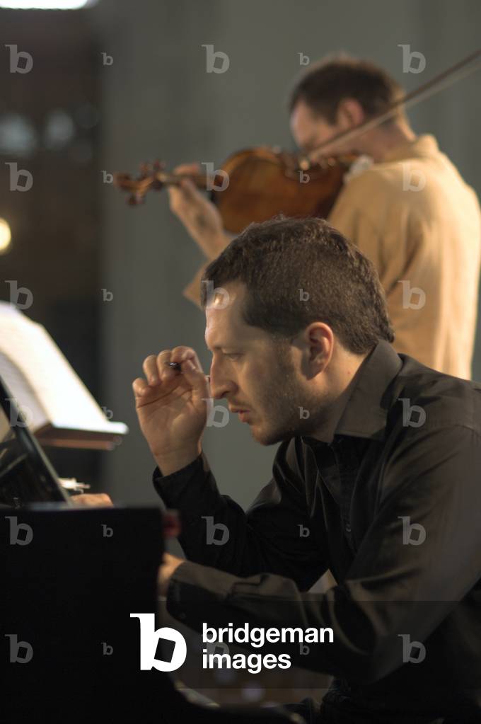 Anthony Marwood and Thomas Ades - portrait of the violinist and English composer and artistic director of the Aldeburgh festival in Orford Church during the Aldeburgh Festival, June 2005
