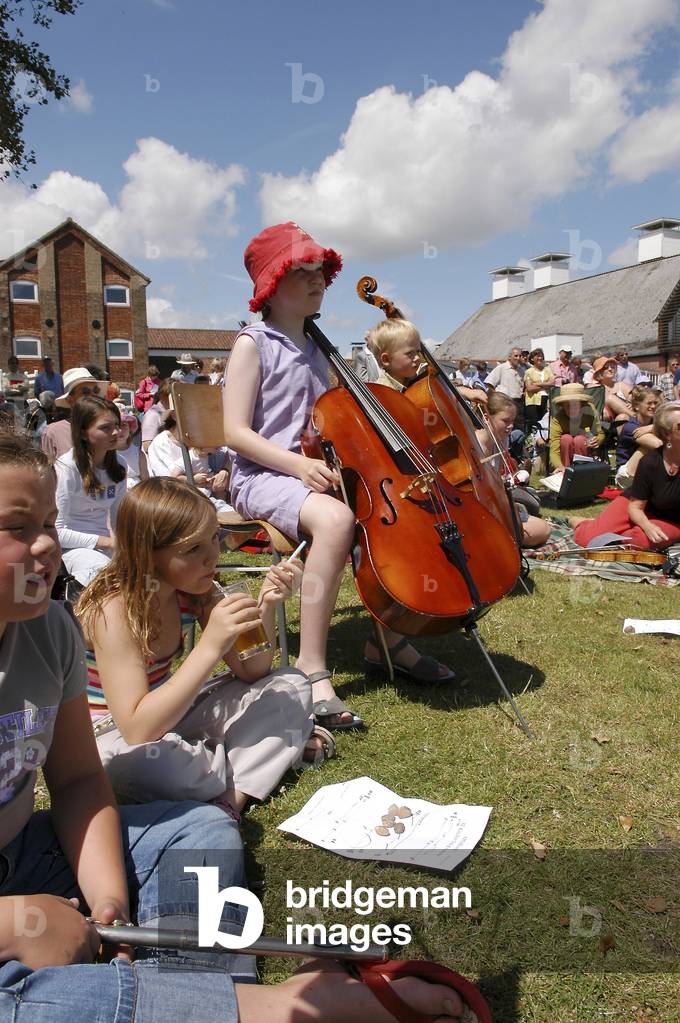 Fringe band at Snape Maltings, little girl playing the cello, part of Aldeburgh Festival 2004