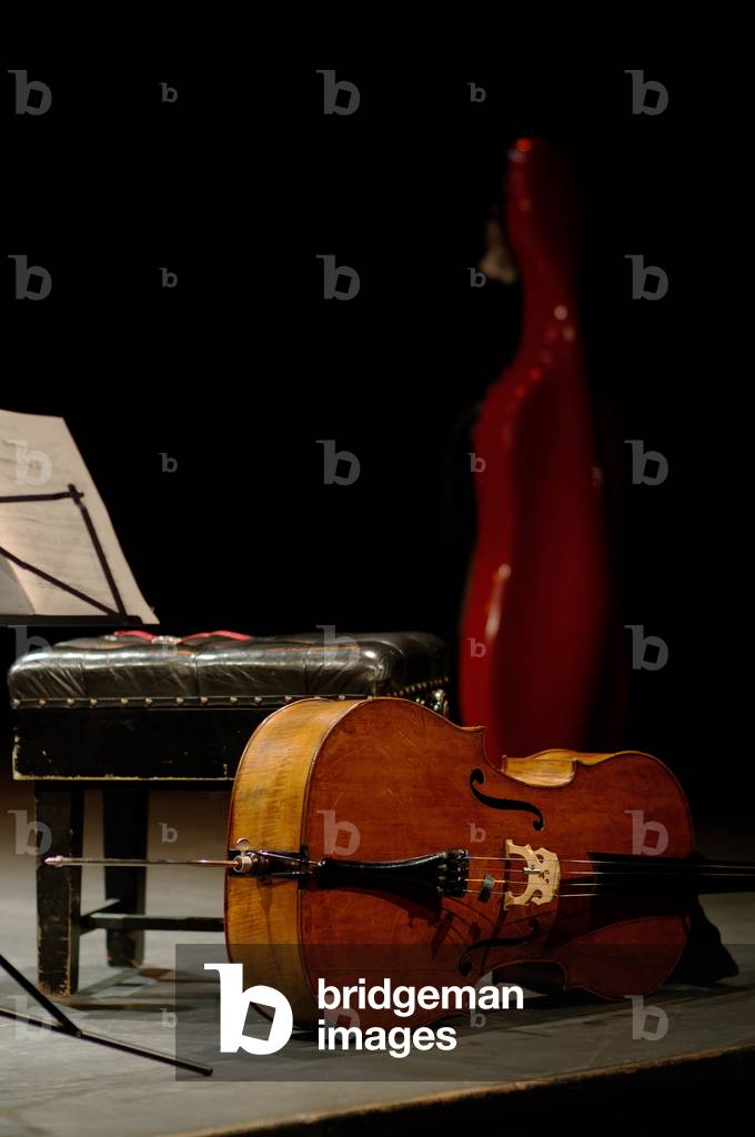 Cello on its side with case, music stand and music stool in the background Jubilee Hall, Aldeburgh, England, 15th October 2005