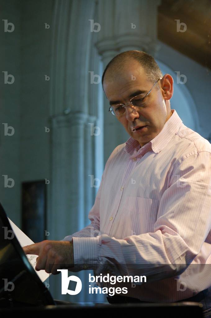 Iain Burnside  playing  piano, taken from the side, at Aldeburgh Festival 2004