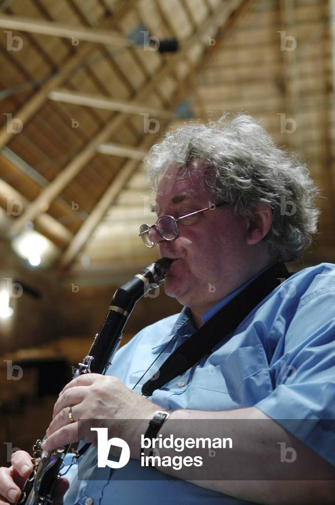 Alan Hacker playing bass clarinet, Aldeburgh Festival, Snape, England, 2004