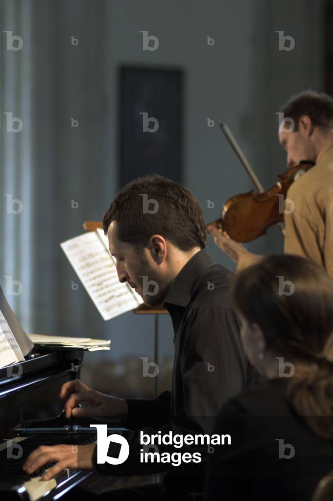 Anthony Marwood and Thomas Ades - portrait of the violinist and English composer and artistic director of the Aldeburgh festival in Orford Church during the Aldeburgh Festival, June 2005