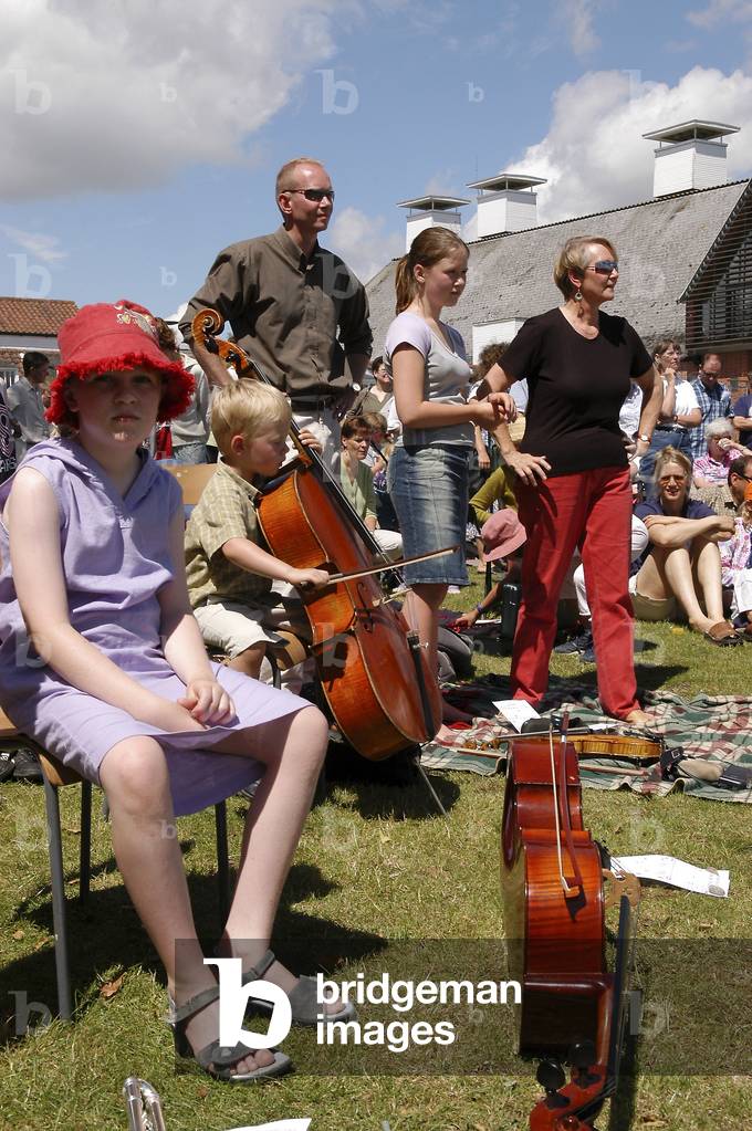 Fringe band at Snape Maltings, little boy playing the cello, part of Aldeburgh Festival 2004
