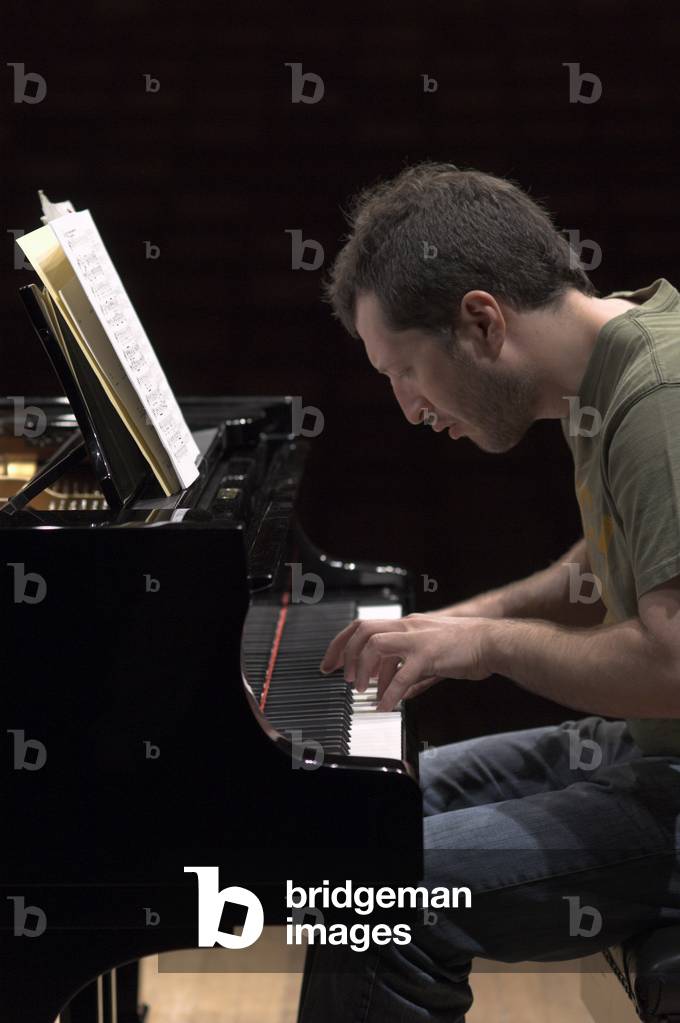 Thomas Ades - portrait of the English composer and artistic director of the Aldeburgh festival rehearsing at Snape Maltings during the Aldeburgh Festival, 1 June 2005