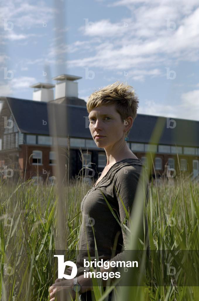 Tansy Davies - portrait of the English composer in front of Snape Maltings concert hall, Aldeburgh, UK, June 2007
