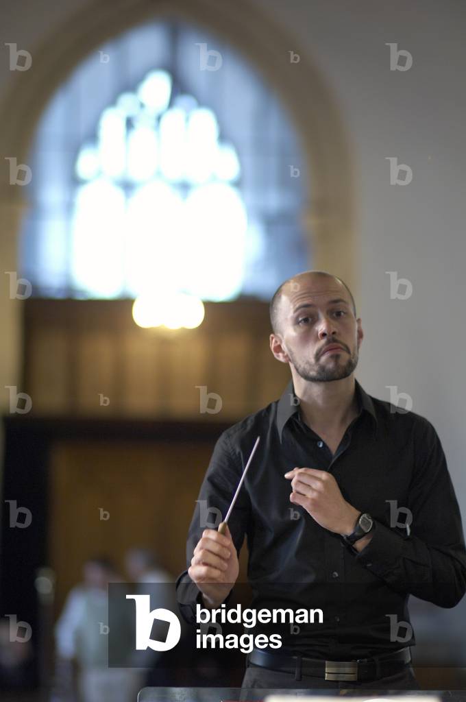 Richard Baker - British composer and conductor rehearsing at the Aldeburgh parish curch,Suffolk, UK, June 2007
