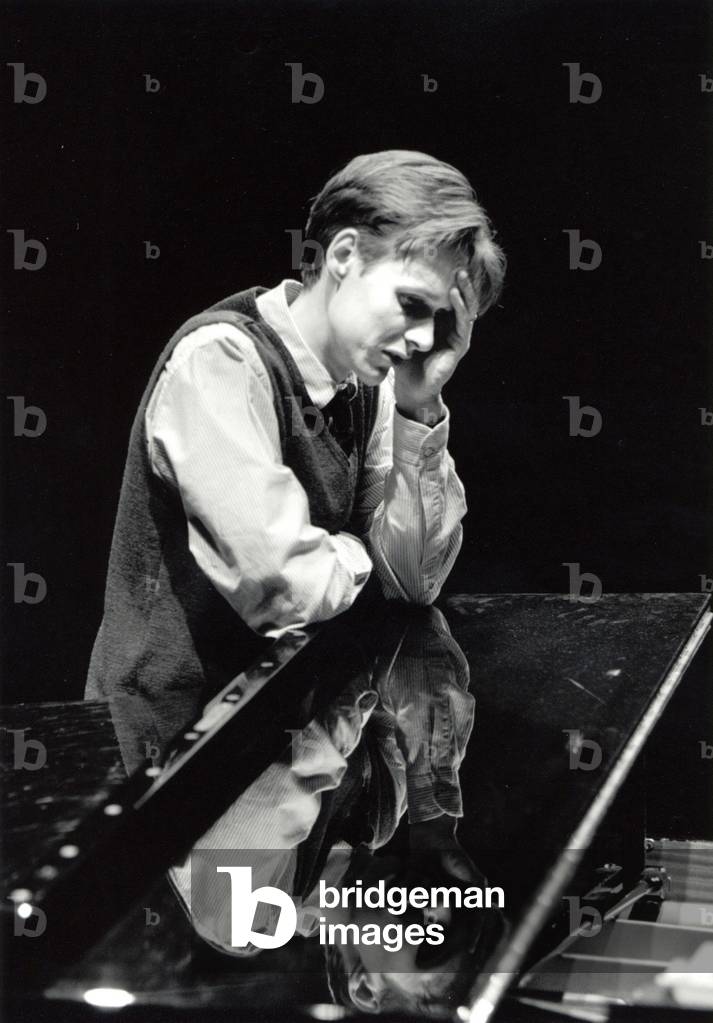 Ian Bostridge leaning on piano, Aldeburgh 1998 English tenor