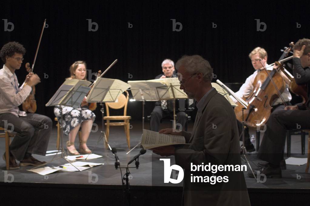 Poul Ruders - portrait of the Danish composer looking at a music score in front of the Kroger String Quartet in Jubilee Hall, Aldeburgh during the Aldeburgh Festival, June 2005