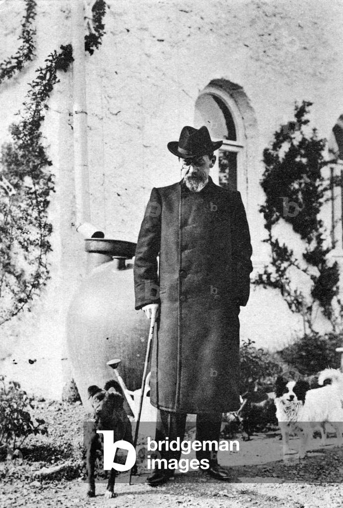 Anton Chekhov - portrait with cane and dog