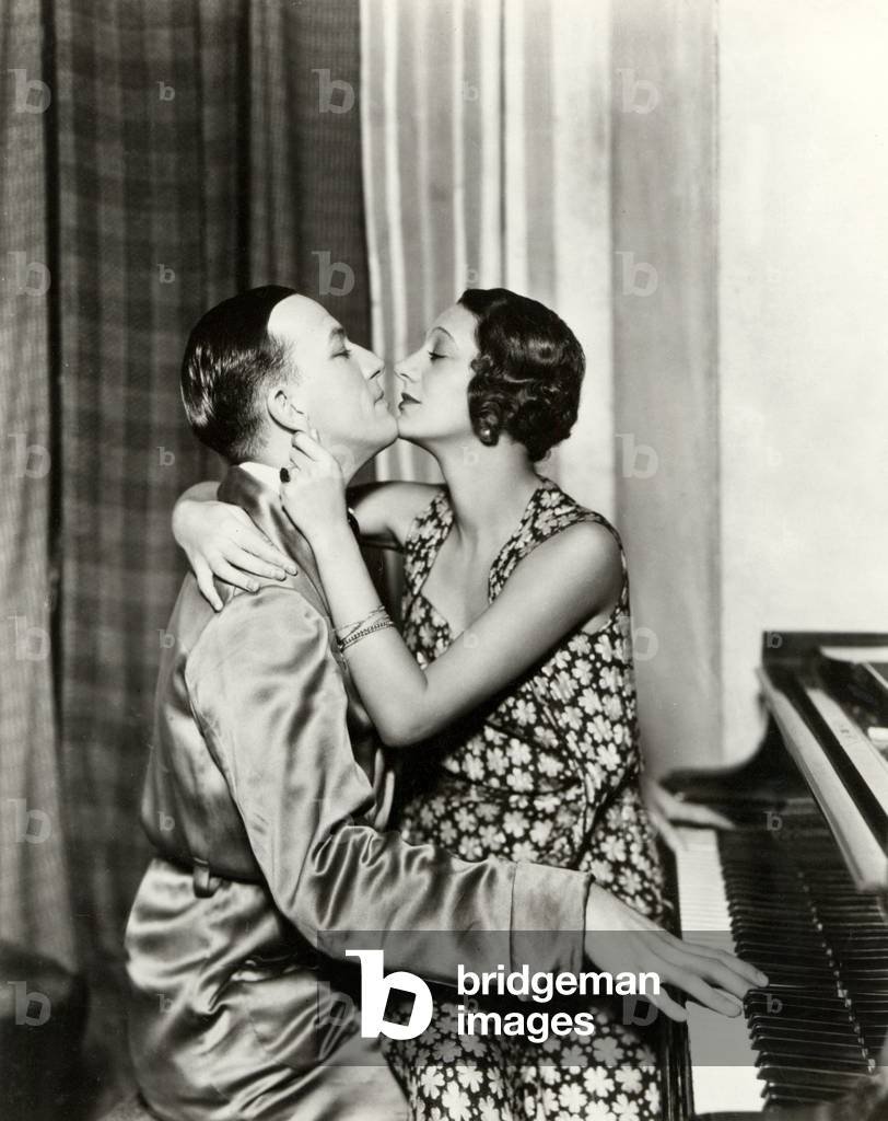 Scene from Noel Coward's ' Private Lives ' 1932 with Noel Coward at the piano and  Gertrude Lawrence   on his lap