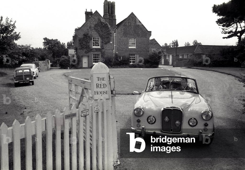 Benjamin Britten leaving his house in a car, Aldeburgh, Suffolk,  1964 (photo)