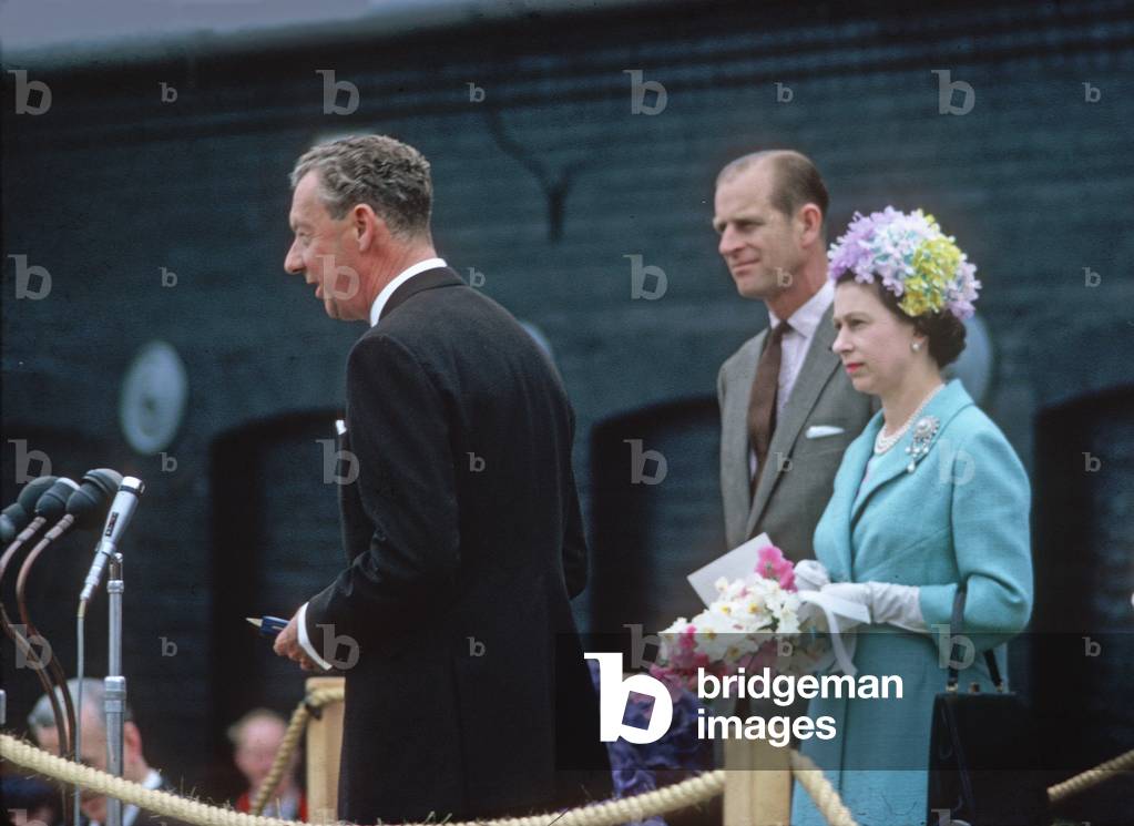 Benjamin Britten at the microphone with HM Queen Elizabeth II and Prince Philip nearby on the occasion of the opening of the Snape Maltings Concert Hall, Aldeburgh, Suffolk, June 2, 1967 (photo)