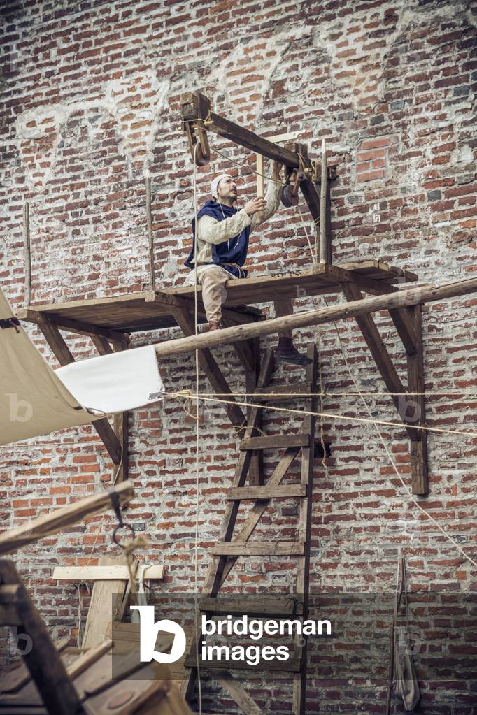 Work site with scaffolding, Middle Ages, Italy XIII century, Hypothesis reconstructive military civil life inside a castle, Soncino, Lombardy, Italy (photo)