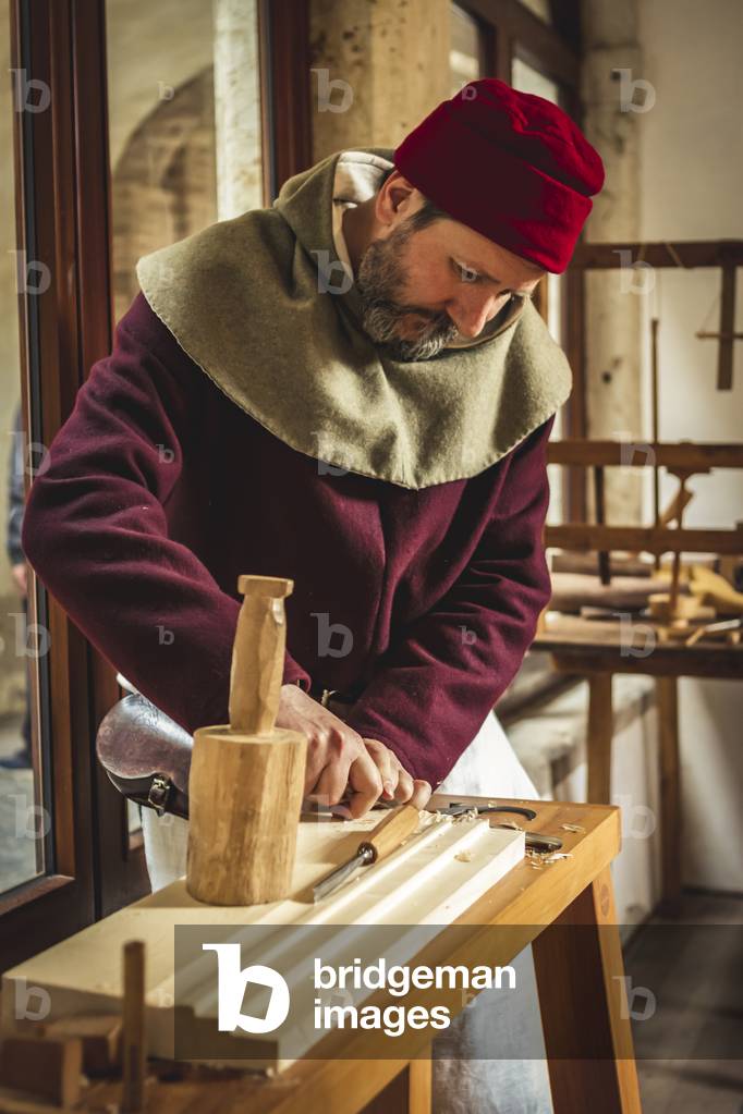 Reconstructive hypothesis of customs and customs, arts and crafts 14th century: The carpenter's workshop, Villafranca di Verona, Veneto, Italy (photo)