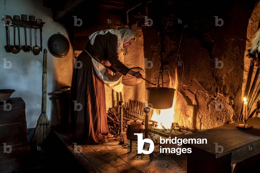 Daily life, XIII century: Small hamlet of the Tuscan Apennines: at the hearth of a modest farmhouse, dinner is prepared, central Italy, Prato, Italy (photo)