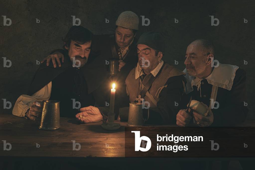 17th century, North Italy: country militia. Reconstructive hypothesis civil and military uses and customs. In the tavern you play dice, Verrua Savoia, Turin, Piedmont, Italy (photo)