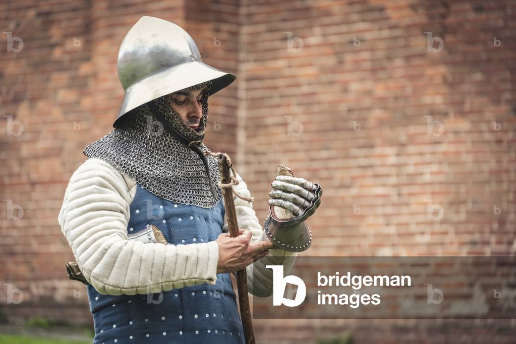 Second half of the 14th century: Portrait of a man of arms with helmet, gambeson and brigantine, Marimondo, Milan, Italy (photo)