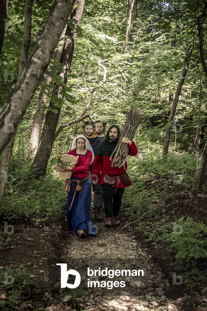 Rietro home after a day of hard work in the woods, Daily life early 15th century, Northern Italy, Piedmont, Italy (photo)