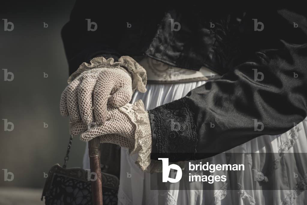 Honeymoon trip to Turin, young couple: detail of gloves and women's dress., Torino, Piedmont, Italy (photo)