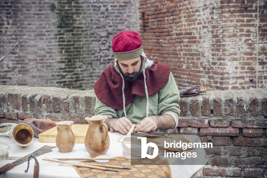 Artisan, Middle Ages, Italy XIII century, Hypothesis reconstructive military civilian life inside a castle, Soncino, Lombardy, Italy (photo)