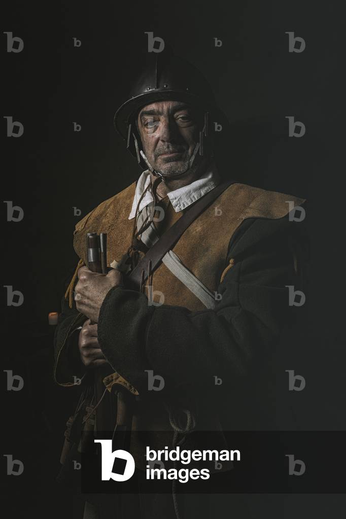 17th century, North Italy: country militia. Reconstructive hypothesis civil and military uses and customs. Portrait of archibugere, Verrua Savoia, Turin, Piedmont, Italy (photo)