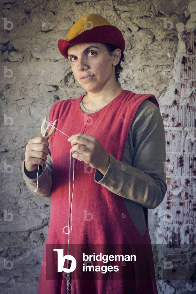 Portrait of a woman with lucet, Daily life early 15th century, Northern Italy, Piedmont, Italy (photo)