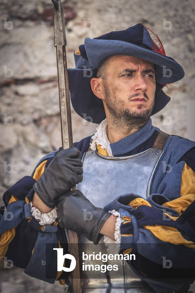 Civil and military customs and customs: Fante with halberd., Castel Beseno, Trento, Italy (photo)