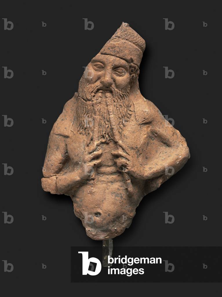 Bearded figure playing double flutes, 5th century BC (terracotta)