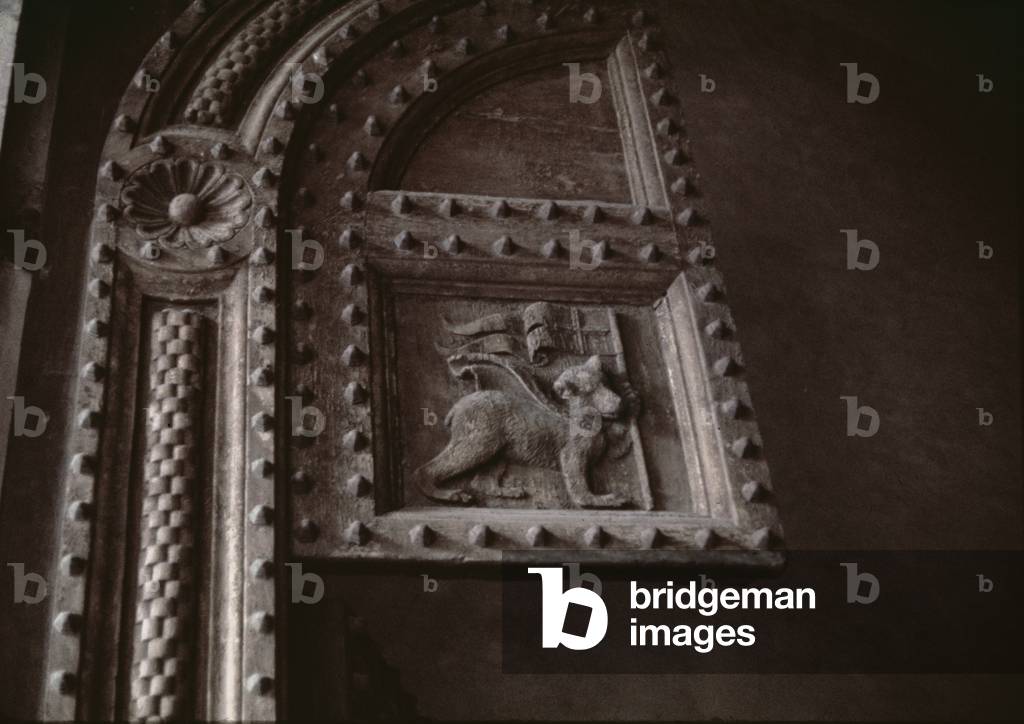 Carved door panel from the Duomo, showing a bear cub carrying a flag, 14th century (wood)
