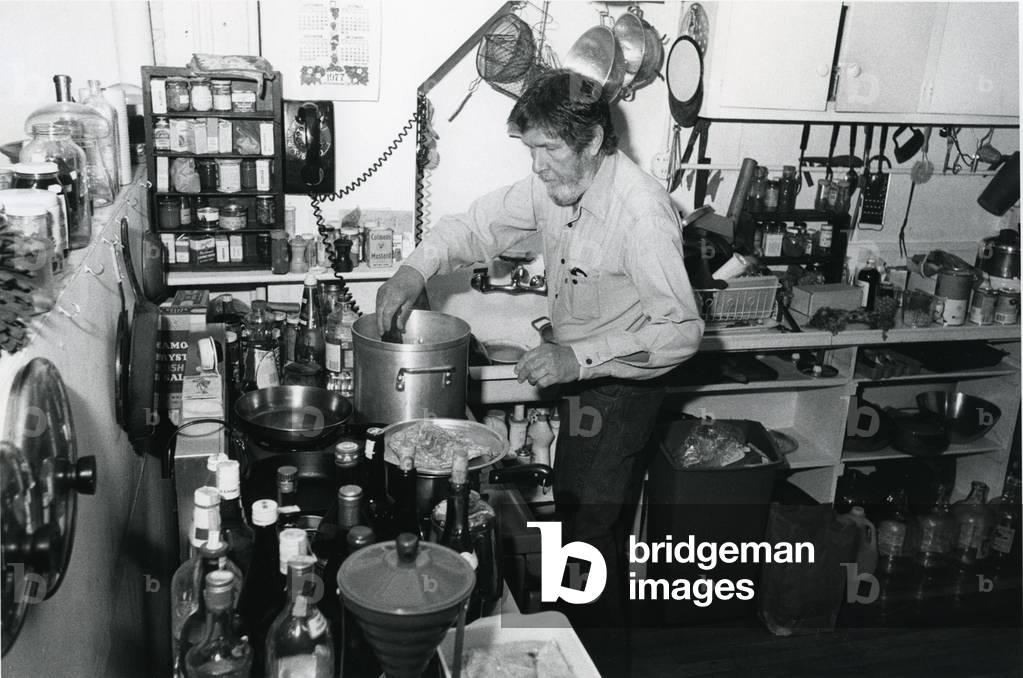 John Cage cooking, 1977 (photo)