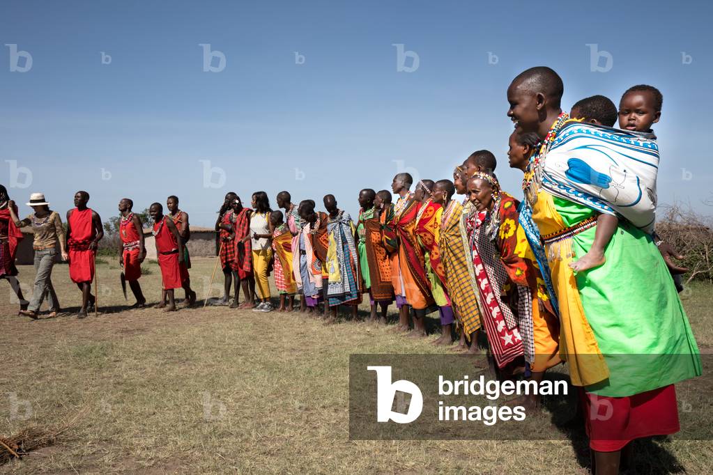 Masai villagers with tourists, Masai Mara, Kenya, Africa September 2018 (photo)
