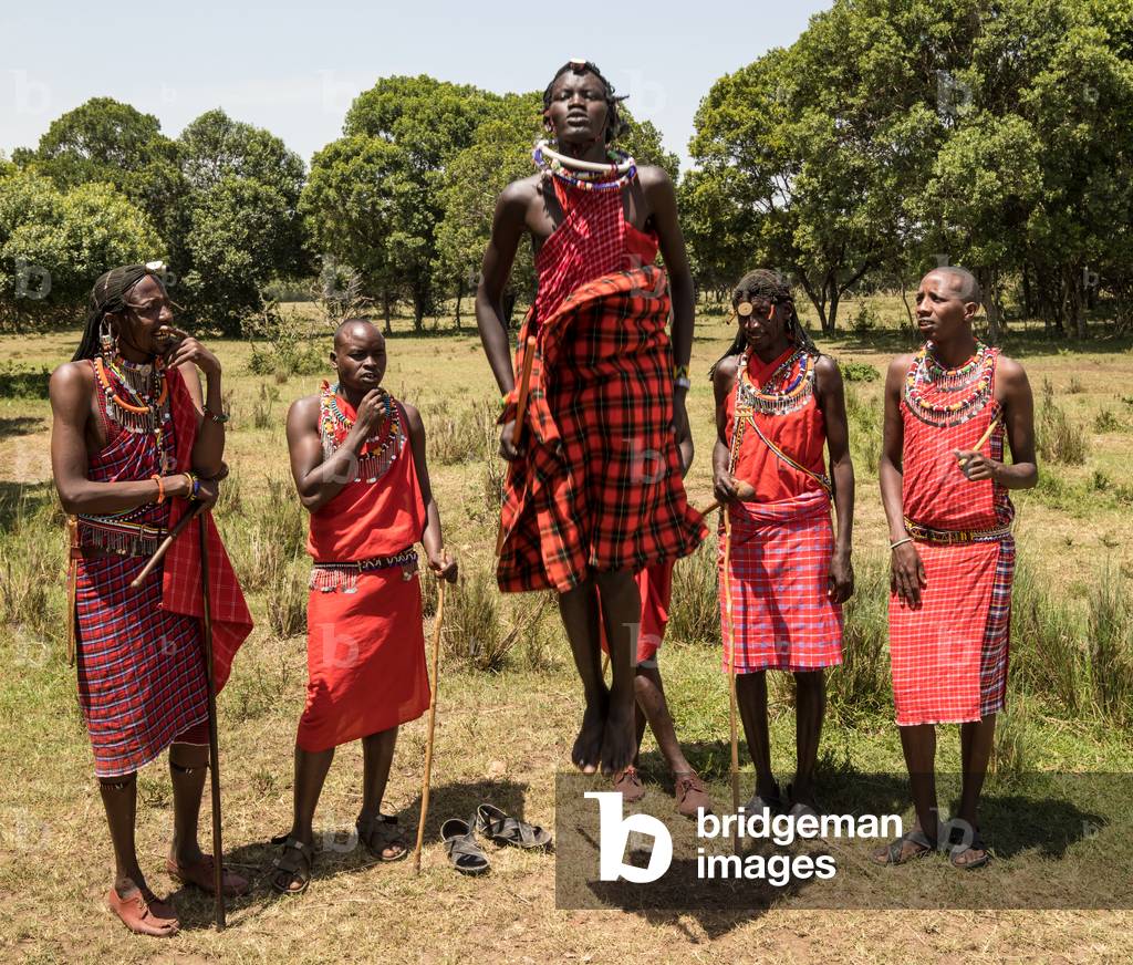 Masai warriors performing jumping dance, Masai Mara, Kenya, Africa September 2018 (photo)