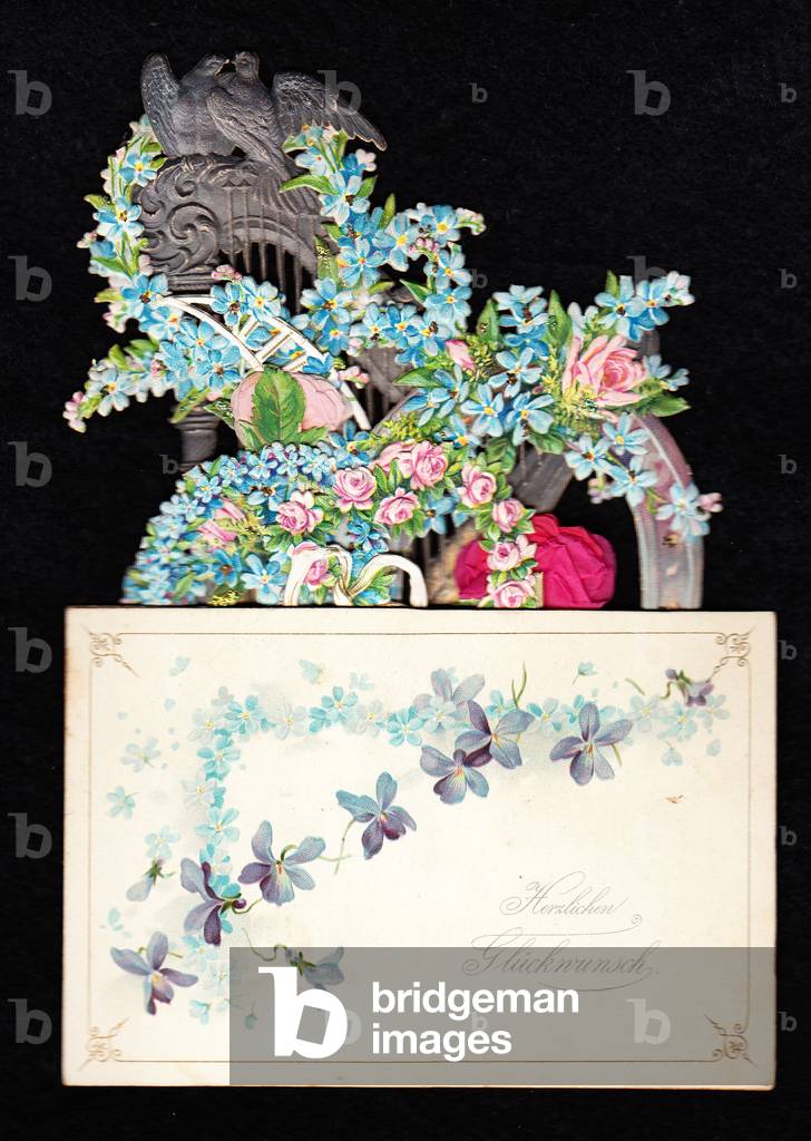 A Victorian die cut pop up greeting card of a harp entwined with forget-me-nots and roses, c. 1880 (colour litho)