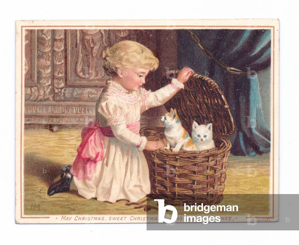 A Victorian Christmas card of a little girl opening a wicker basket and looking at two kittens in it,c.1880 (colour litho)