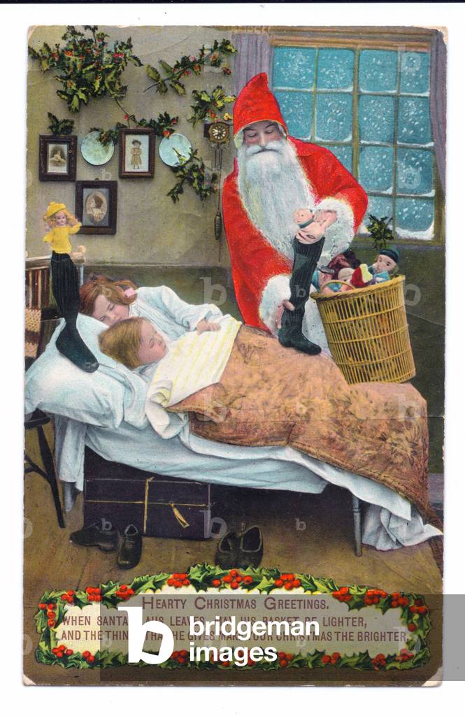 Edwardian Christmas postcard of Father Christmas leaving toys next to two sleeping children, c.1910 (colour litho)