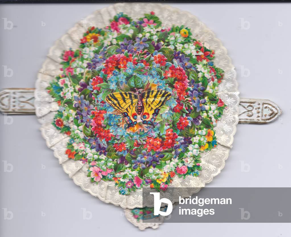 A Victorian lace edged mechanical greeting card of roses and tulips tiered in a circle topped with a butterfly motif, c.1880 (colour litho)